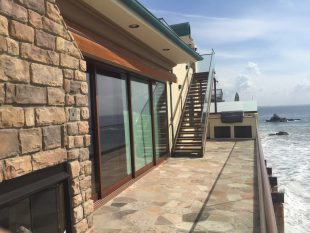 Screen doors installed in balcony in Malibu home