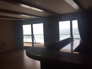 Screen doors installed in entertainment bar room in Malibu home