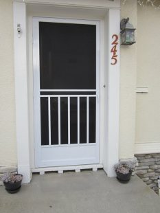 Craftman style swinging screen door .